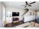 Cozy living space with hardwood floors, a ceiling fan, and stairs leading to the upper level at 769 Seigle Point Dr, Charlotte, NC 28204