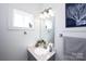 Bright powder room featuring a white vanity, a large mirror, and modern lighting at 769 Seigle Point Dr, Charlotte, NC 28204
