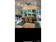 Bright dining room with large windows, stylish furnishings, and adjacent kitchen area at 8011 Greencastle Dr, Charlotte, NC 28210