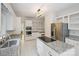 White kitchen with granite countertops, stainless steel appliances, and plenty of storage at 8011 Greencastle Dr, Charlotte, NC 28210