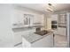Modern kitchen features granite countertops, stainless steel appliances, and a functional center island at 8011 Greencastle Dr, Charlotte, NC 28210
