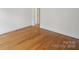 Inviting living space boasts hardwood floors and neutral walls, creating a versatile and welcoming atmosphere at 8011 Greencastle Dr, Charlotte, NC 28210