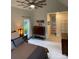 Cozy main bedroom with a ceiling fan, sitting area, and ensuite bathroom at 8011 Greencastle Dr, Charlotte, NC 28210