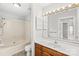 Bathroom featuring a combination tub and shower, updated vanity, and ample lighting at 8155 Cedar Glen Dr, Charlotte, NC 28212