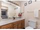Well-lit bathroom with a single sink vanity and ample storage at 8175 Cedar Glen Dr, Charlotte, NC 28212