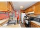 Well-equipped kitchen featuring a convenient breakfast bar and warm ambiance at 8175 Cedar Glen Dr, Charlotte, NC 28212