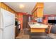 Functional kitchen with wood cabinets, modern appliances, and breakfast bar at 8175 Cedar Glen Dr, Charlotte, NC 28212