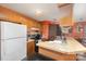 Efficient kitchen features wood cabinets and a convenient breakfast bar at 8175 Cedar Glen Dr, Charlotte, NC 28212