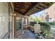 Charming porch with wood ceiling, chairs, and well kept shrubs at 8175 Cedar Glen Dr, Charlotte, NC 28212