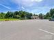 Spacious parking lot with easy access to amenities and well-maintained landscaping at 8212 Merryvale Ln, Charlotte, NC 28214