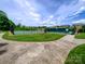 Well-maintained tennis courts in a community setting with lush green surroundings at 8212 Merryvale Ln, Charlotte, NC 28214