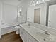 Elegant bathroom featuring dual sinks, and a separate tub and shower at 8715 Green Ivy Ln, Charlotte, NC 28217