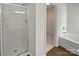Clean bathroom featuring a shower, bathtub, and well-lit vanity with modern fixtures at 8715 Green Ivy Ln, Charlotte, NC 28217