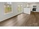 Open concept dining room view featuring a seamless transition to a modern kitchen at 8715 Green Ivy Ln, Charlotte, NC 28217