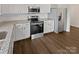 Well-equipped kitchen with stainless steel appliances, granite countertops, and ample cabinet space at 8715 Green Ivy Ln, Charlotte, NC 28217