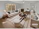 Bright living room featuring a fireplace, large window, and stylish decor with a modern rug at 8715 Green Ivy Ln, Charlotte, NC 28217