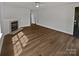 Spacious living room featuring a modern fireplace and a large front door at 8715 Green Ivy Ln, Charlotte, NC 28217