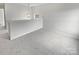 Open loft space offering versatile use, featuring a modern light fixture and neutral carpet at 8715 Green Ivy Ln, Charlotte, NC 28217