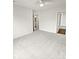Large main bedroom featuring neutral carpet, multiple doors, and ensuite bathroom at 8715 Green Ivy Ln, Charlotte, NC 28217