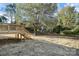 A look at the home's wooden back deck, backyard, and mature trees at 914 Saluda St, Rock Hill, SC 29730