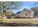 View of the home and backyard from a different angle, partially shaded by a mature tree at 914 Saluda St, Rock Hill, SC 29730
