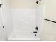 Bathroom featuring a white bathtub with black hardware, a shower, and a towel rack at 914 Saluda St, Rock Hill, SC 29730