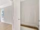 Bathroom with white walls, flooring, and a sliding door opening to the shower and tub at 914 Saluda St, Rock Hill, SC 29730