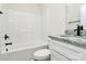 Bright bathroom featuring a tub and shower combo and a granite-topped vanity with modern fixtures at 914 Saluda St, Rock Hill, SC 29730