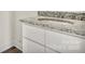 Bathroom vanity with granite countertops, white cabinets, and white walls at 914 Saluda St, Rock Hill, SC 29730