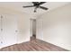Bedroom with neutral walls and floors, a ceiling fan, a closet, and access to other rooms at 914 Saluda St, Rock Hill, SC 29730