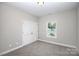 This bedroom has carpet flooring, neutral walls, and a window for natural lighting at 914 Saluda St, Rock Hill, SC 29730