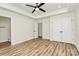 Spacious bedroom includes closet, ceiling fan, lighting, and ensuite bathroom with dark hardware at 914 Saluda St, Rock Hill, SC 29730