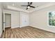 Spacious bedroom with an ensuite bathroom, closet, bright light, and dark hardware at 914 Saluda St, Rock Hill, SC 29730