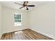 Bedroom featuring vinyl floor, neutral colors, a modern ceiling fan and a bright window at 914 Saluda St, Rock Hill, SC 29730