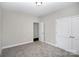 This bedroom offers neutral walls, carpet flooring, and closet storage at 914 Saluda St, Rock Hill, SC 29730