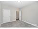 A simple bedroom with gray carpet and neutral walls at 914 Saluda St, Rock Hill, SC 29730