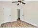 Bedroom with vinyl floors, closet, an ensuite bathroom, a ceiling fan, and neutral colors at 914 Saluda St, Rock Hill, SC 29730