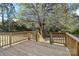 Spacious wooden deck with wood railings and steps leading to the backyard at 914 Saluda St, Rock Hill, SC 29730