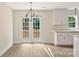 Bright dining area featuring white cabinets, wood flooring, and French doors at 914 Saluda St, Rock Hill, SC 29730