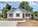 Charming single-story home featuring gray and white siding, stylish windows, and a well-manicured front yard at 914 Saluda St, Rock Hill, SC 29730