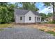 Charming home featuring gray and white siding, a new roof, and a partially landscaped yard at 914 Saluda St, Rock Hill, SC 29730