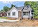 The exterior of a home showcases a front entrance with traditional brick steps and gray and white siding at 914 Saluda St, Rock Hill, SC 29730