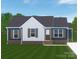 New construction home with white trim, dark siding, complementary brick, and green front lawn at 914 Saluda St, Rock Hill, SC 29730