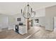 Bright kitchen with white cabinets, granite countertops, stainless steel appliances, and hardwood floors at 914 Saluda St, Rock Hill, SC 29730
