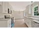 Open kitchen with granite countertops, stainless steel appliances, and a view into the dining area at 914 Saluda St, Rock Hill, SC 29730