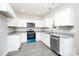 Modern kitchen with stainless steel appliances, white cabinetry, and granite countertops at 914 Saluda St, Rock Hill, SC 29730