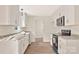 Unfinished kitchen featuring granite counters, stainless steel appliances, and wood flooring at 914 Saluda St, Rock Hill, SC 29730