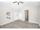 Living room featuring a vaulted ceiling, ceiling fan, and an entry to the backyard at 914 Saluda St, Rock Hill, SC 29730