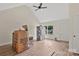 Bright, unfinished living room with vaulted ceiling, ceiling fan, and a large window at 914 Saluda St, Rock Hill, SC 29730