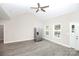 Living room featuring a vaulted ceiling, ceiling fan, and an entry to the backyard at 914 Saluda St, Rock Hill, SC 29730